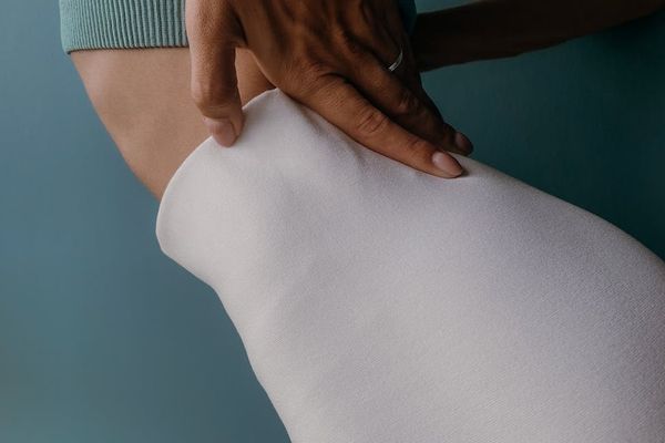 Close-up of a dynamic stretching movement focusing on form.